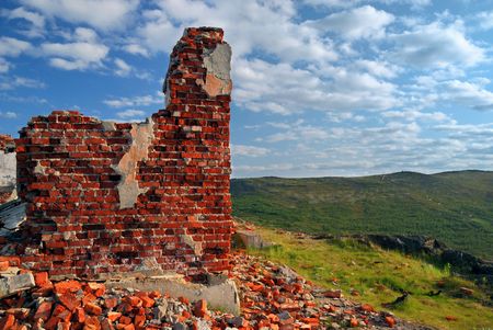 Ruins from a red brick at top of a hillの写真素材