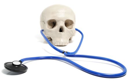 Smart skull with stethoscope isolated on whiteの写真素材