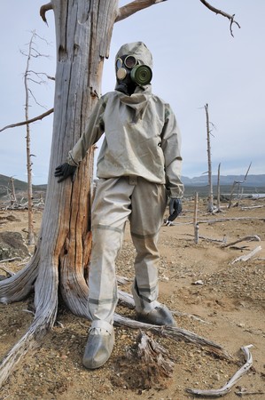 The person in protective suit in the dead forestの写真素材