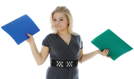 The young woman carrying document folders. Isolated on white backgroundの写真素材