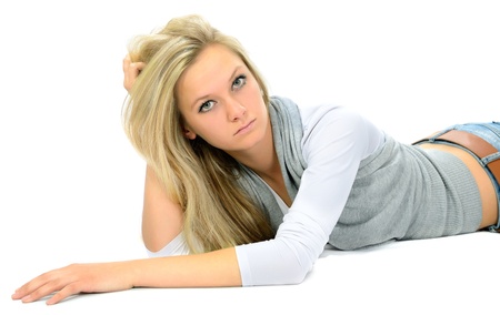 The serious girl on a white background.の写真素材