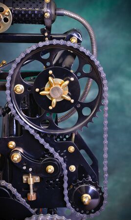 Chain drive: black chain on black gears.