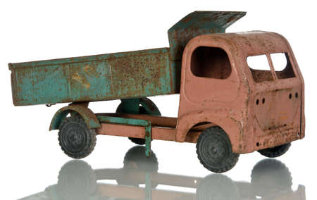 Old rusty toy on a white background. Child dump truck.の写真素材