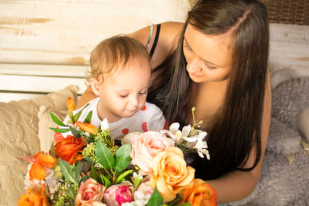 Pretty smiling mother and daughter