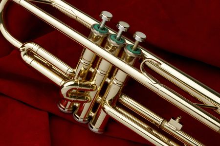 Close up shot of trumpet on red suede backgroundの写真素材