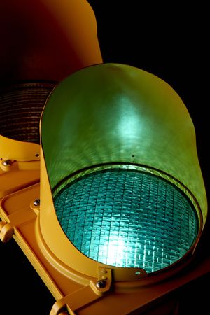 Traffic light as shot from below with green light aglow