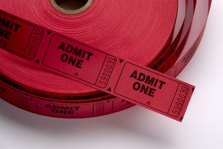 Close up shot of a roll of red Admit One tickets shot on white background with soft shadowの写真素材