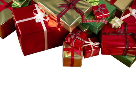 Christmas presents wrapped in shiny gold, red and green paper with ribbons and shot on white background with space for copyの写真素材