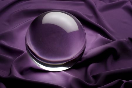 glowing crystal ball shot on purple satinの写真素材