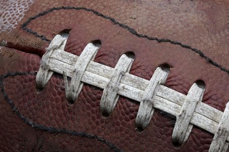 Close-up shot of old roughed up football fills frameの写真素材