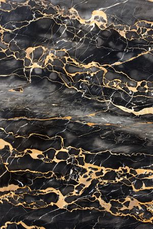 Dark gray and black marble with golden veins fill frameの写真素材