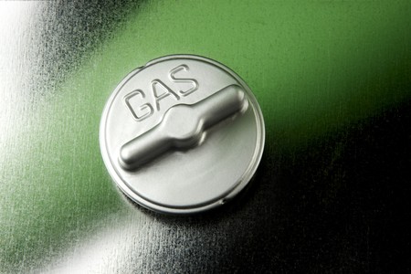 Close up of automobile gas cap shot on metal backgroundの写真素材