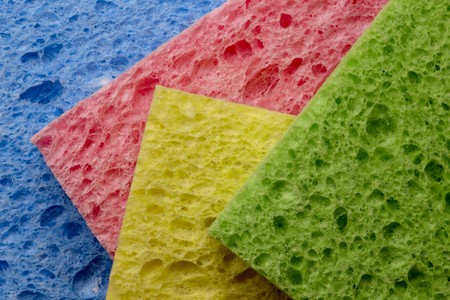 Macro shot of four colorful spongesの写真素材