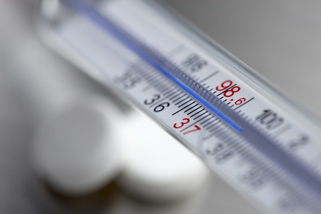 Close up of household thermometer shot with narrow depth of field causing foreground and background to be out of focusの写真素材
