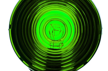 Extreme close up of lens from an illuminated Green lightの写真素材