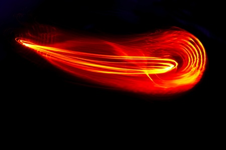 Meteor effect created in the studio with moving red light includes space for copyの写真素材