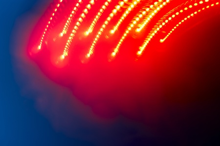 Glowing lights fall from top of frame includes room for copyの写真素材
