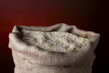 Sack of white rice in burlap sack shot in studio with space for copyの写真素材