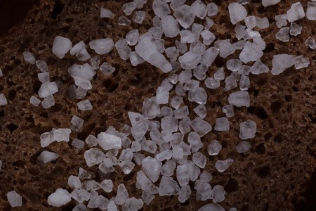 Bread with sea salt. Macro dark background.の写真素材