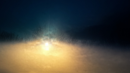 Sunset through the front window of a vehicle
