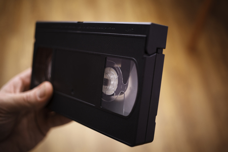 Old VHS on the men hand. Close-upの写真素材