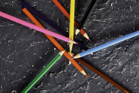 Colored pencils on dark background basisの写真素材