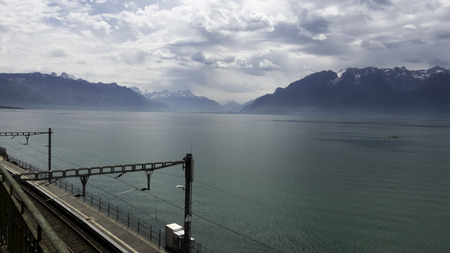 Railway running along the lakeの写真素材