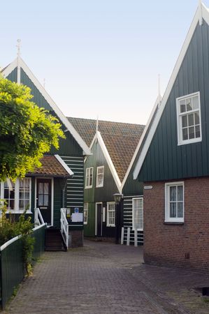 An obscure, typica chapel in the center of Marken, a peninsula in the IJsselmeer, the Netherlands, with it's characteristical wooden gablesの写真素材