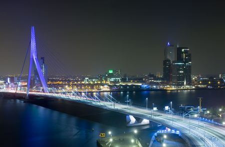The Rotterdam Skyline with the famous Erasmus Bridge over the river Meuze at nightの写真素材