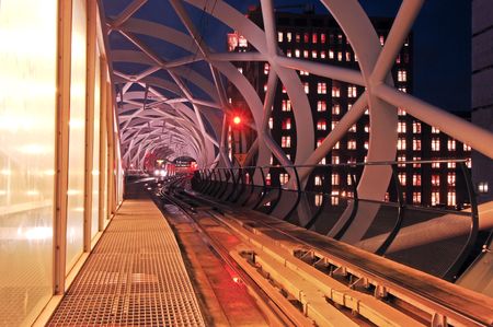 A tram waiting on his approach to the platform in an elevated tram tunnel