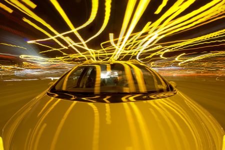 A car driving through the frantic traffic of a busy city during rush hour (Quadruple exposure)の写真素材