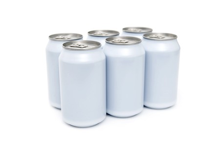 A six pac of off-white beverage cans on a white backgroundの写真素材