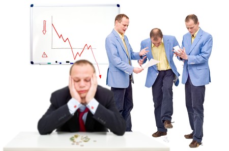 Three unhappy employees, angry at their indecicive boss, in front of a whiteboard showing a negative graph, representing the state of a business in financial crisisの写真素材