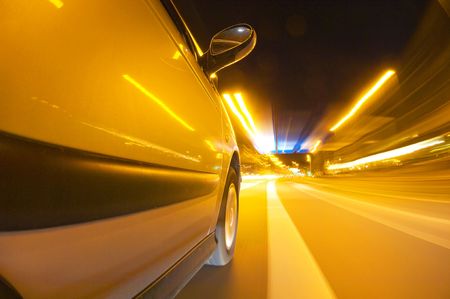 The exterior of a car driving through an urban envrionment, approaching a junctionの写真素材