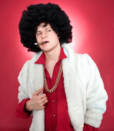 Arrogantly looking man, wearing a wig  and smoking a cigar.の写真素材