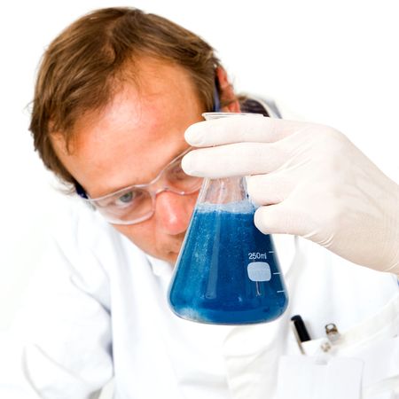 Chemical scientist looking atÊthe fizz and bubbles in an erlenmeyer flaskの写真素材