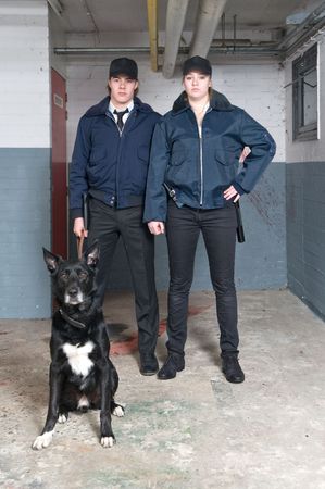Portrait of two young police officers of a k9 squadの写真素材