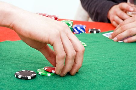 A poker player raising the bet on his game