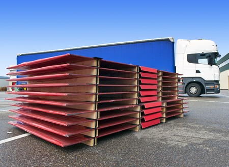 International transport concept, with a pallet ready to be loaded onto a waiting truckの写真素材