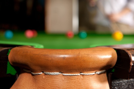 The leather stiched corner pocket of a snooker tableの写真素材