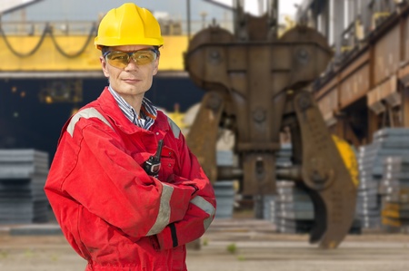 Engineer, posing in front of a steel millの写真素材