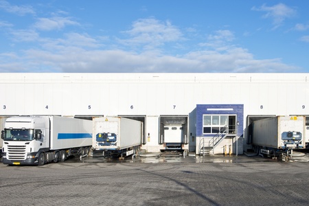 Reafers and containers at the bays or loading docks of a large distributin center