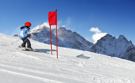 Young child during his ski school slalom run の写真素材