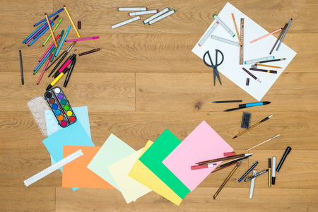 Directly above shot of painting tools on wooden tableの写真素材