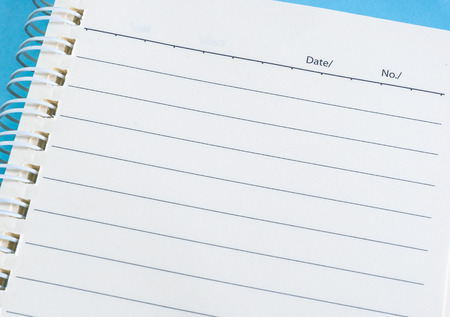 blue notebook and penの写真素材