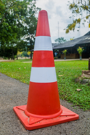an orange traffic cone in the parkの写真素材