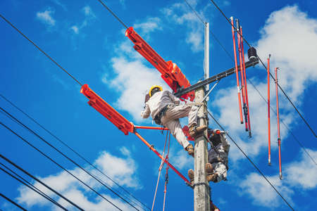 The lineman used tie stick to carve the tie wire used to wrap the electrical wires attached to the...
