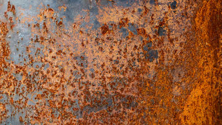 The metal surface is filled with rust that is reddish brown. Gives a retro and vintage feel.