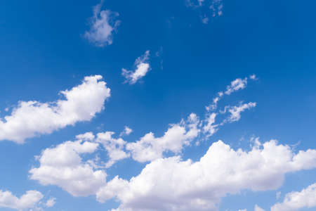 The blue sky with moving white clouds. The most of clouds are beautiful color and shade, suitable...