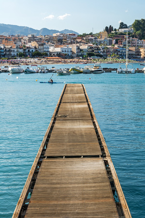 Wooden pier in beautiful Mediterranean bayの写真素材